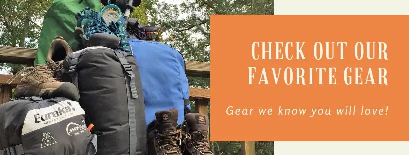 Link to gear guide page with pile of gear in woods