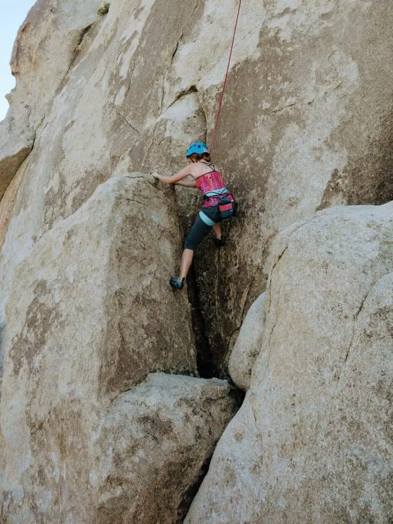woman demonstrating Joshua Tree Rock Climbing