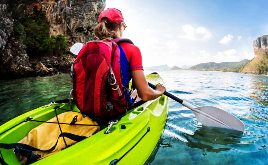 How to Waterproof a Backpack by putting it into a dry sack in a kayak