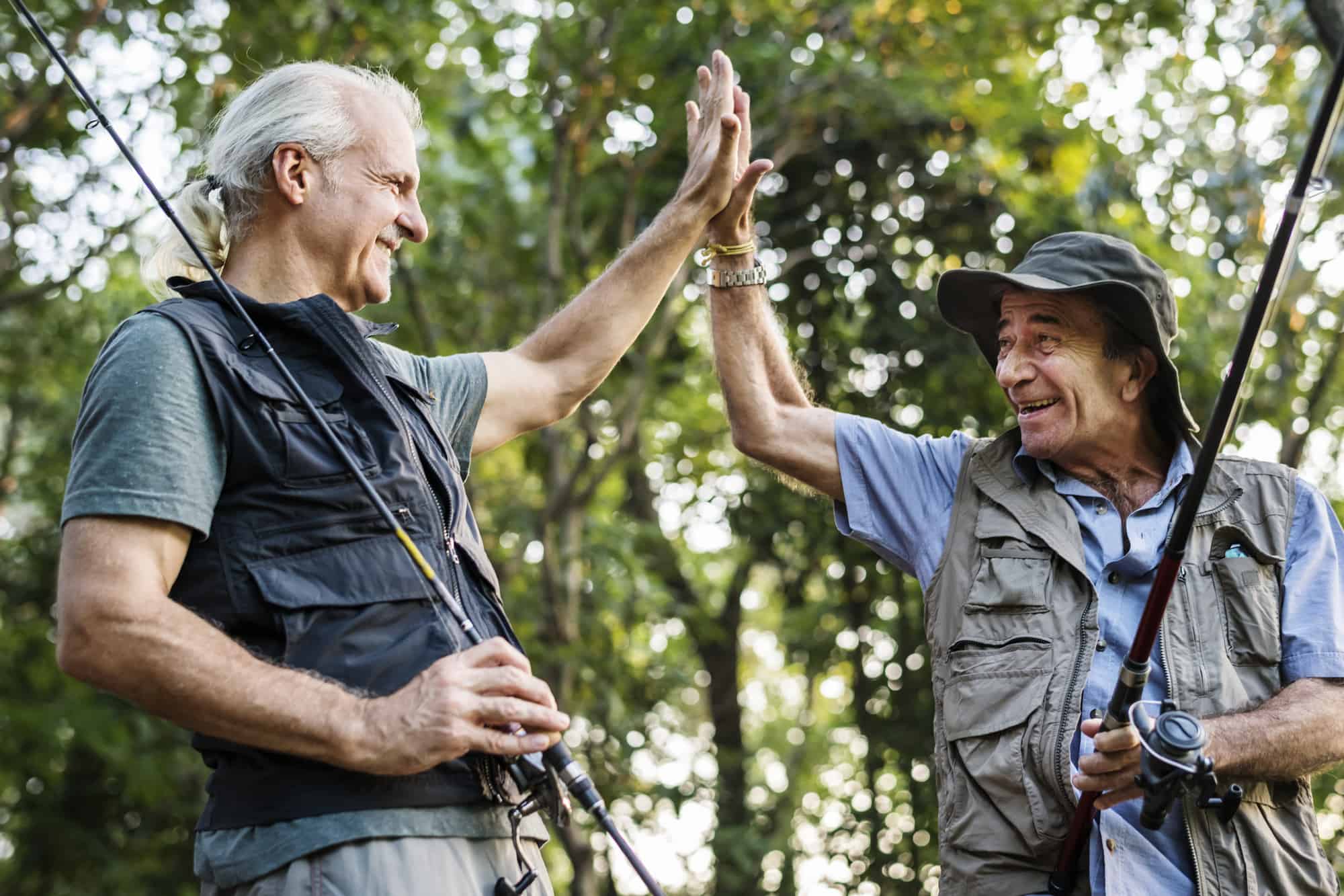 2 guys celebrating receiving the best gifts for fishermen