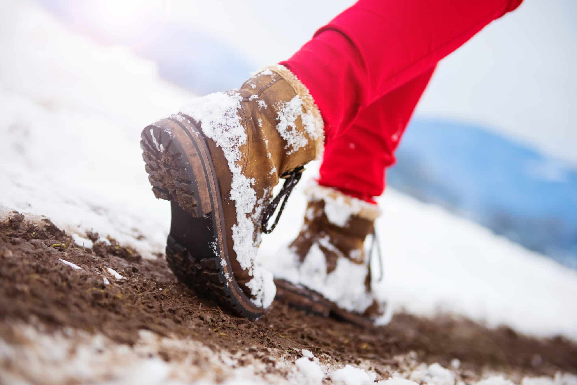 Brown boots hiking in the snow