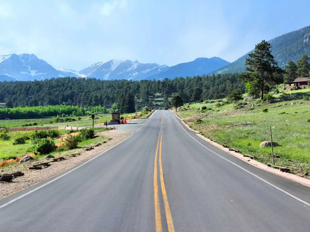 Entrance Road going into Rocky Mountain National Park, trees and mountains in background