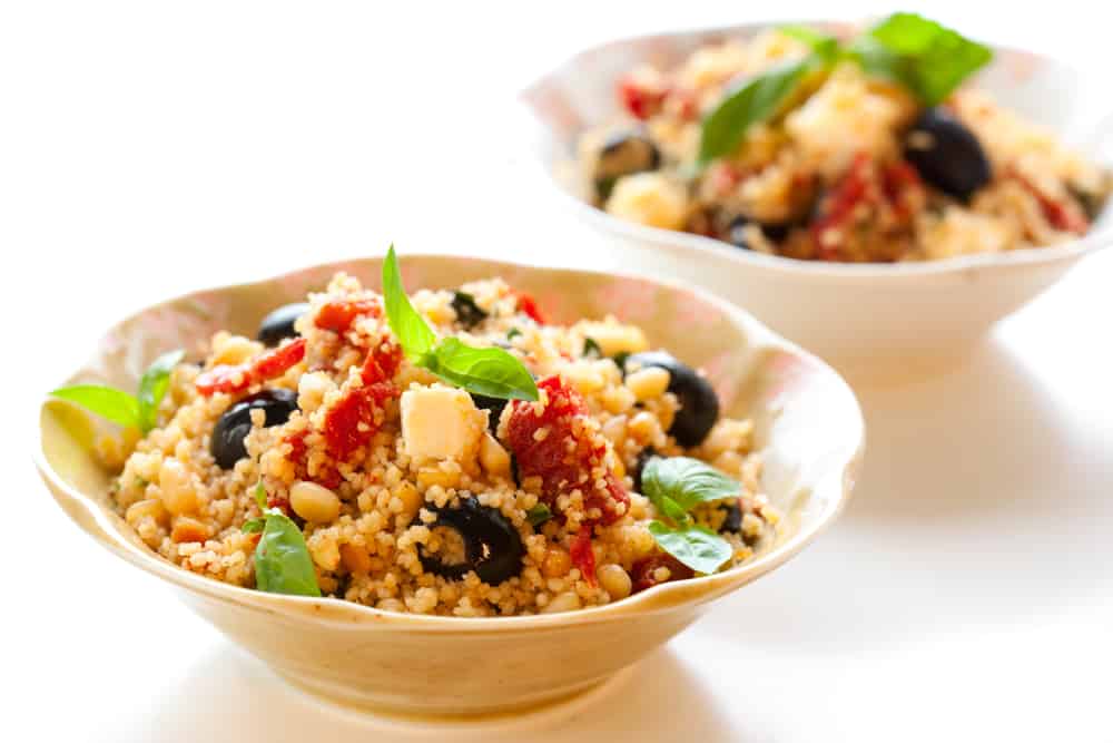 mediterranean couscous salad with dried tomatoes,feta,olives and basil
