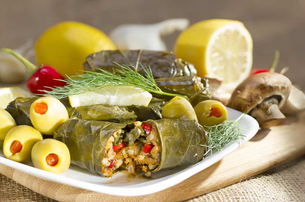 Mediterranean wrap on a white plate with olives