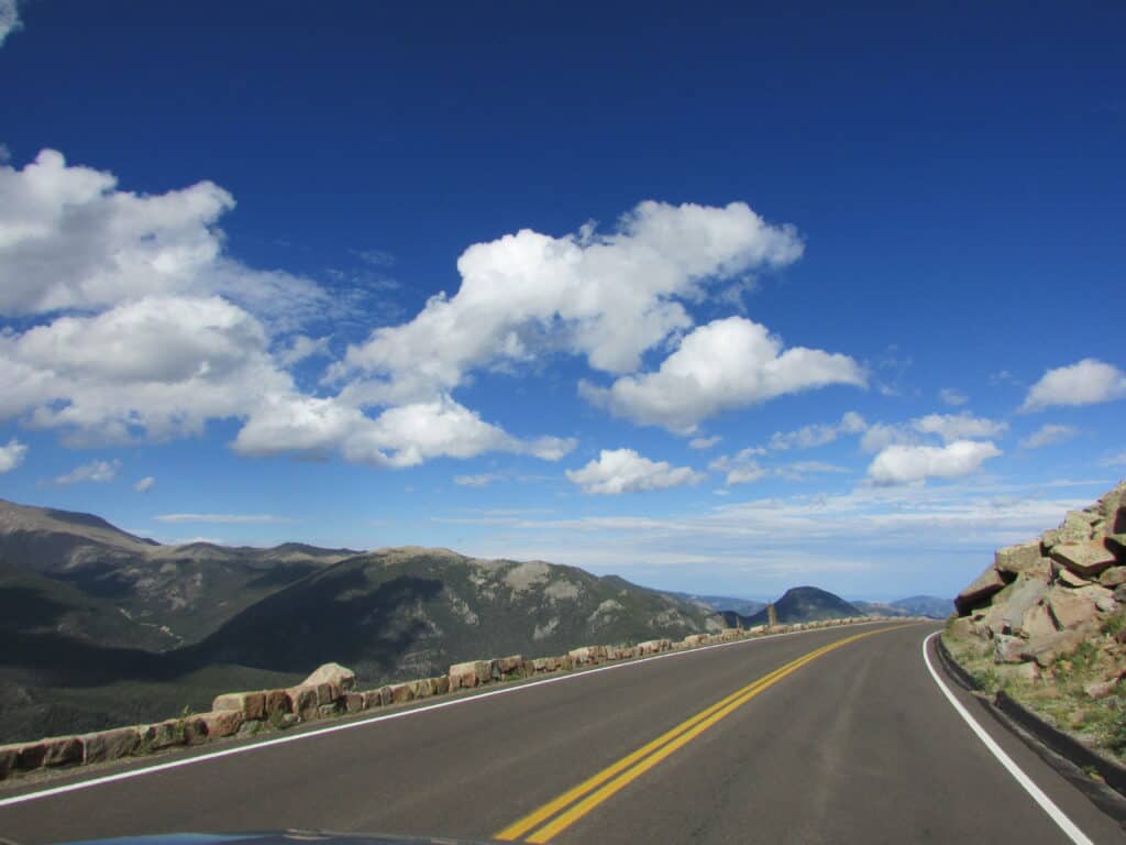 trail ridge road in rocky mountain national park with open sky ahead