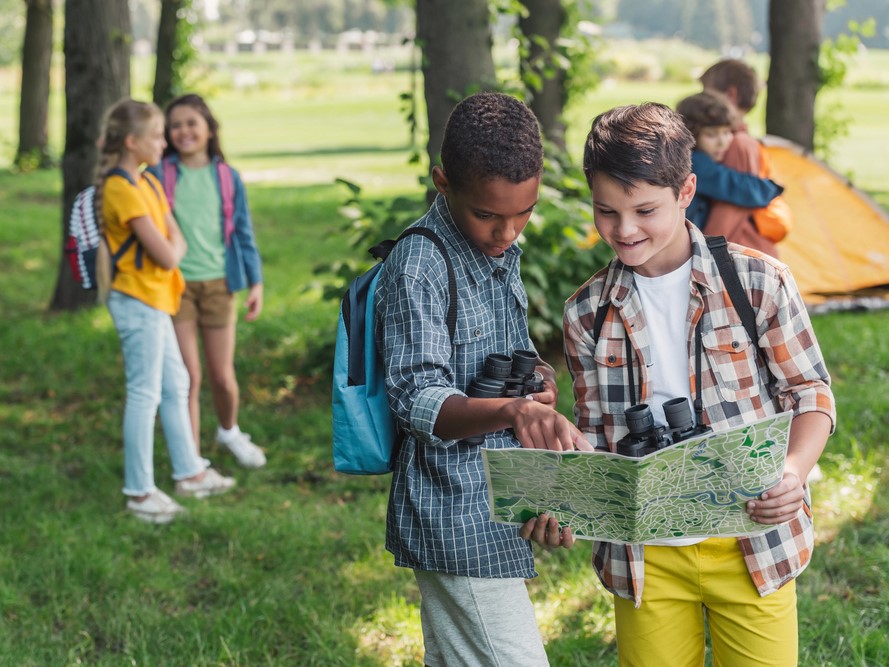 2 boys looking at a map