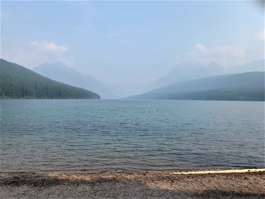 Bowman Lake showing the full length of the lake with mountains in the background.