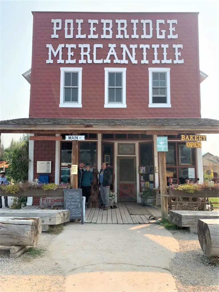 people standing on porch of the Polebridge Mercantile in Polebridge Montana