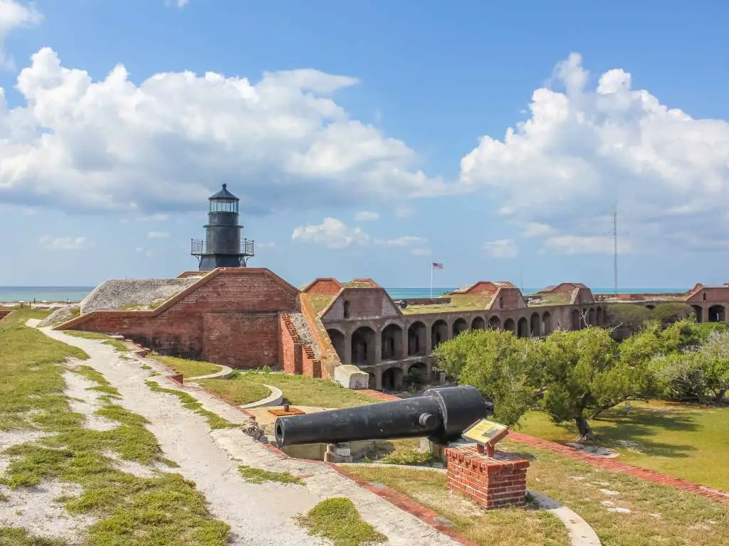 lighthouse sitting on brick walls of fort jefferson in dry tortugas, one of florida national parks