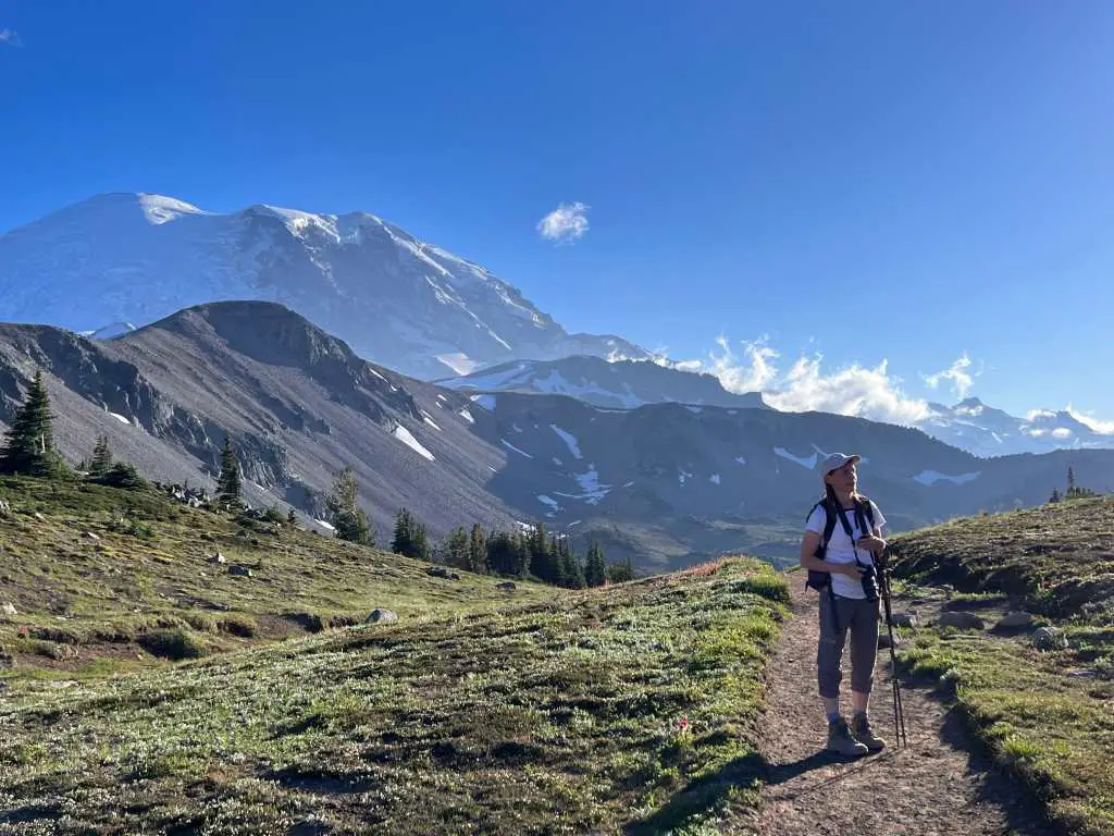 woman hiking on mount fremont trail with mt rainier in background