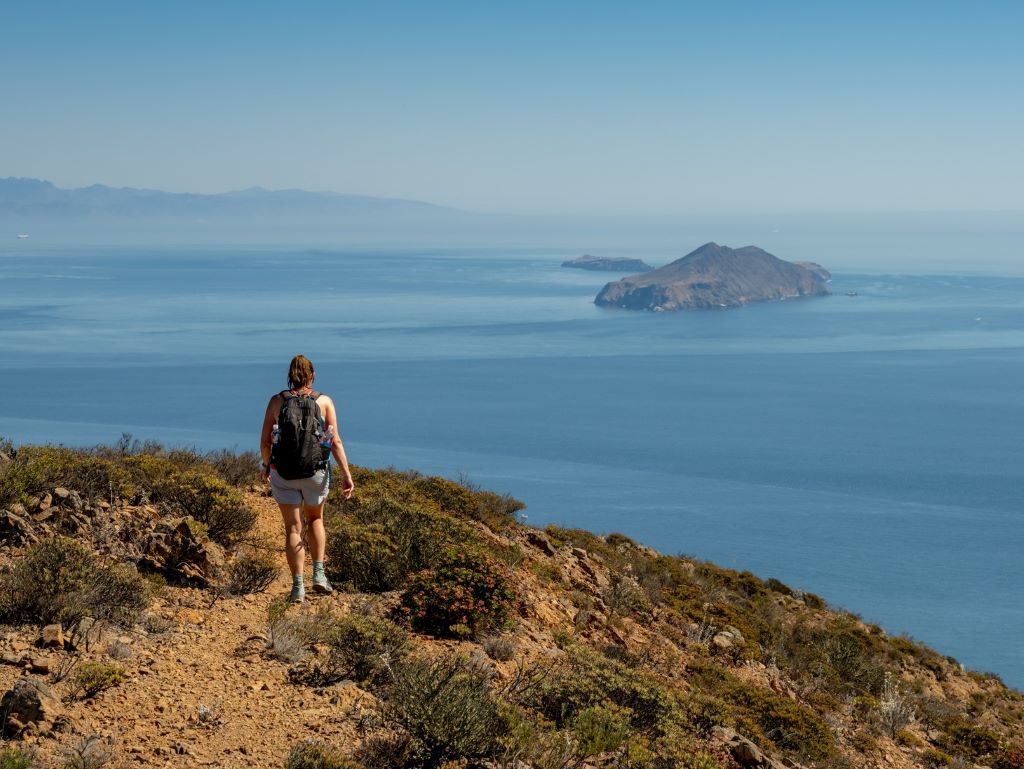 Hiker on Island with Ocean in front