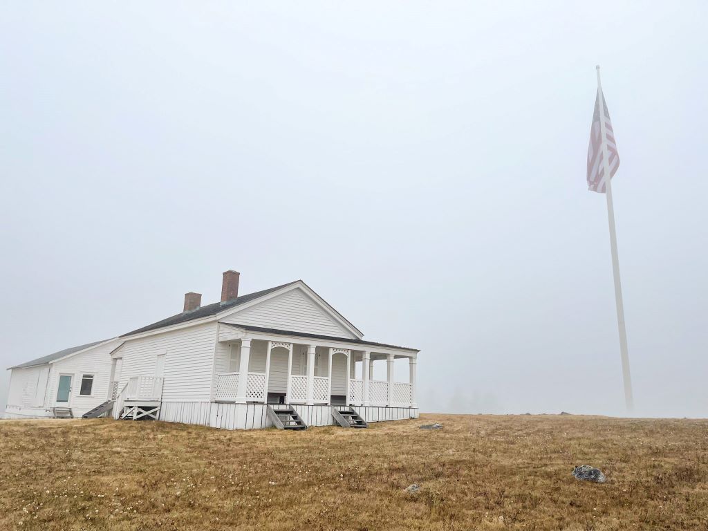 white house sitting on hilltop