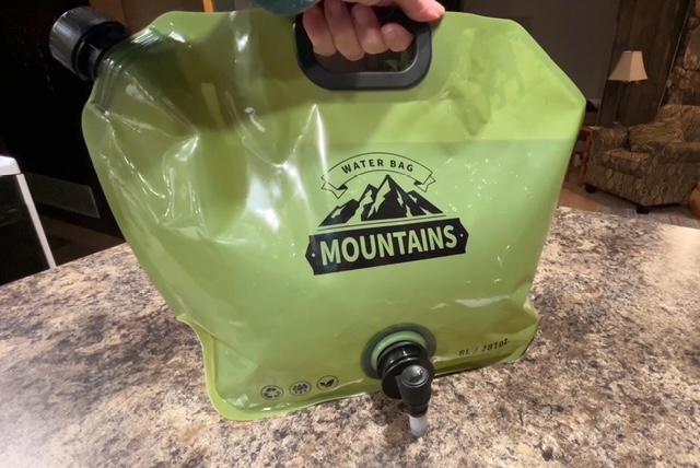 green collapsible water jug