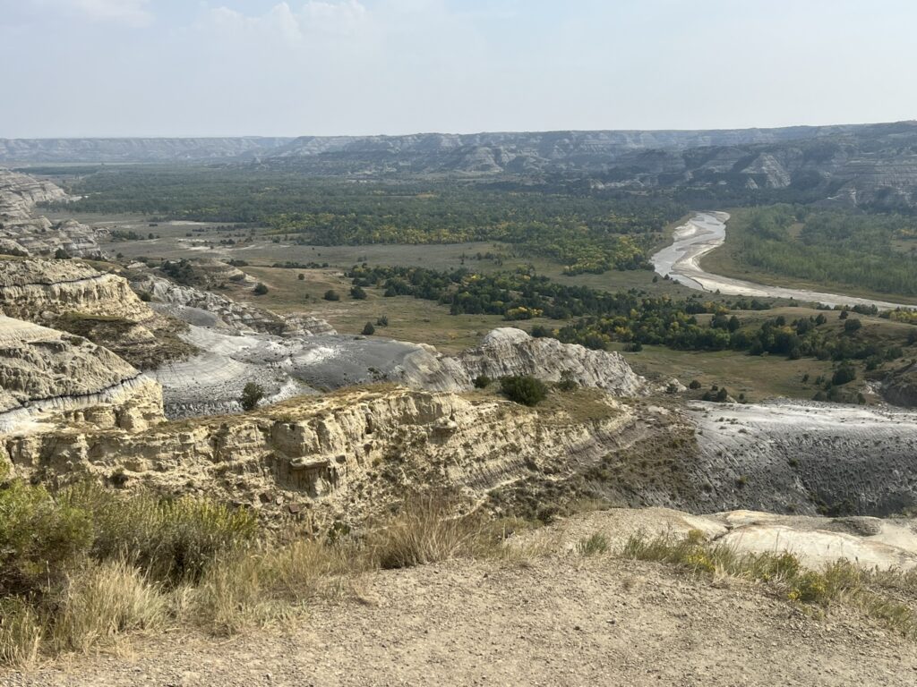 rugged land with river in background