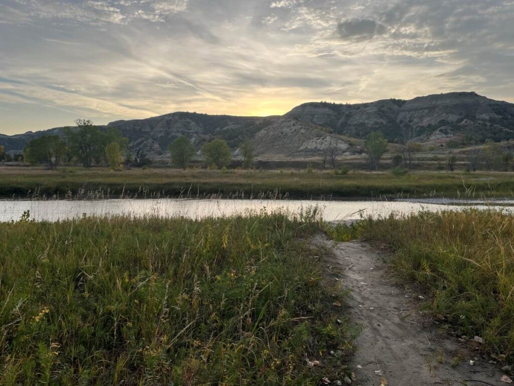 sun setting over badlands from campground