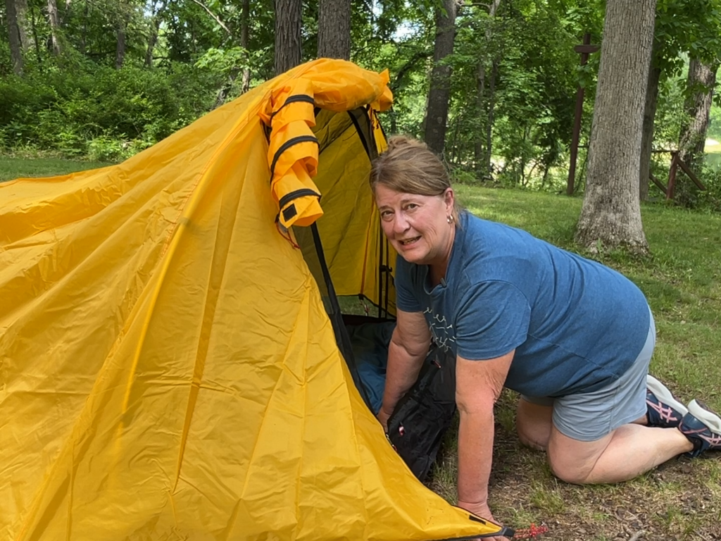woman looking through door of Traverseon Tunnel Duo Tent
